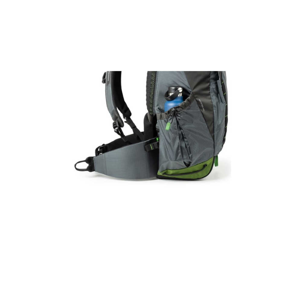 Gray backpack with green accents and a blue water bottle in the side pocket.