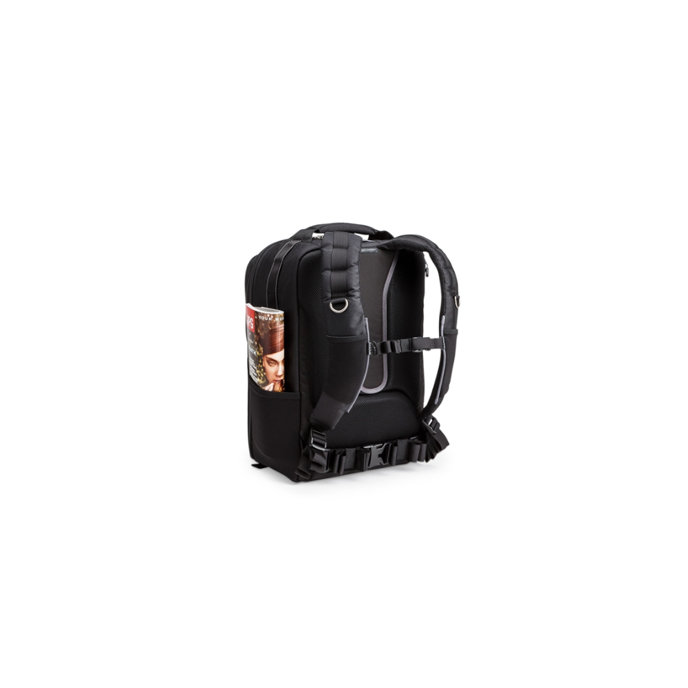 A black backpack with a magazine in its side pocket.