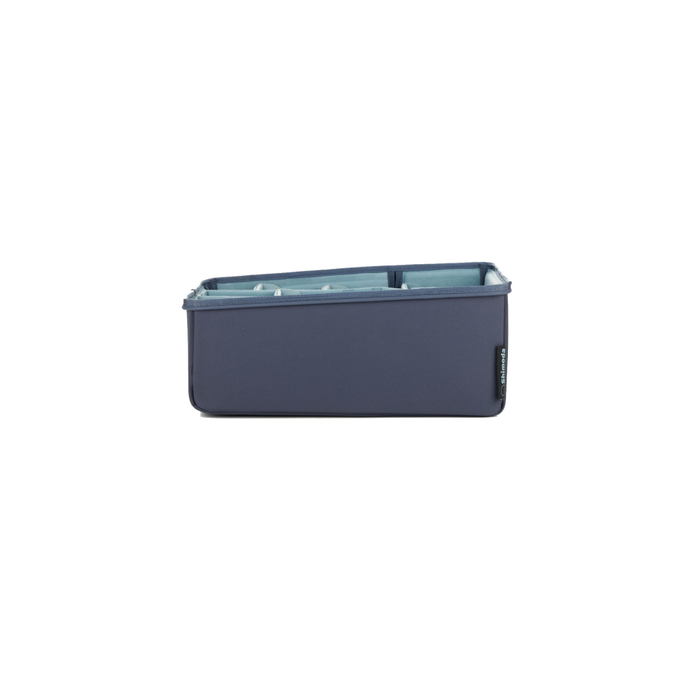 Gray organizer with multiple compartments and blue inserts, featuring a Shimoda logo.