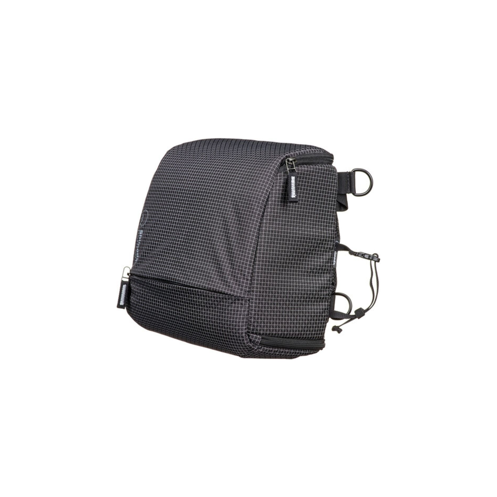 A black checkered bag with zippers and straps on a white background.