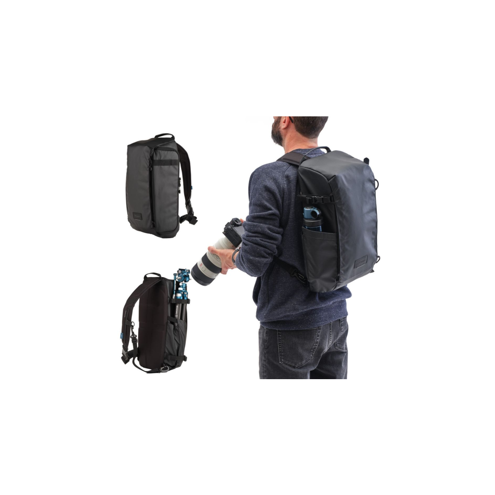 Man with backpack and camera against white background, with two backpacks nearby.
