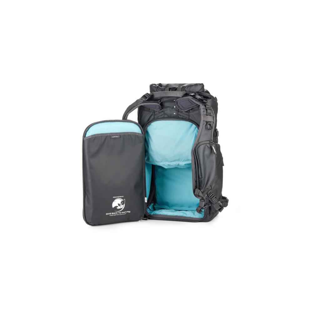 A dark grey backpack with its front panel open, showing a light blue interior.