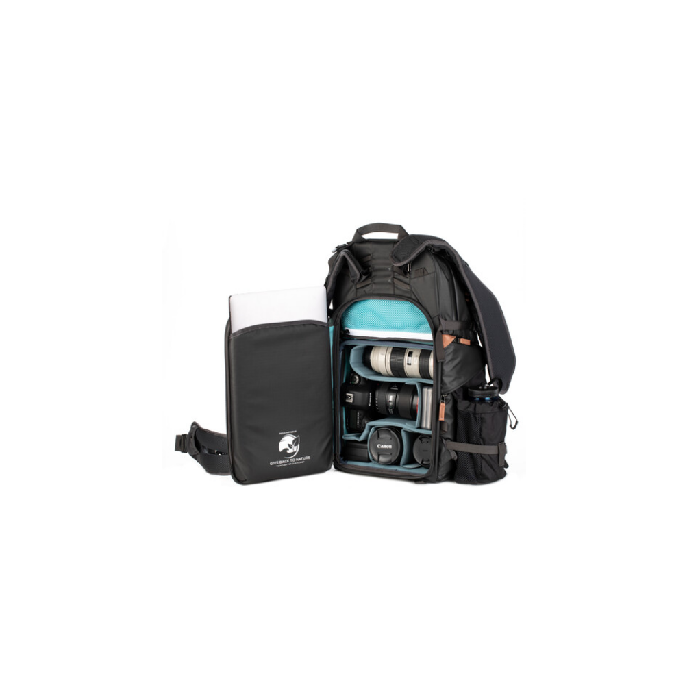 A black backpack with an open compartment showing lenses and a laptop sleeve.