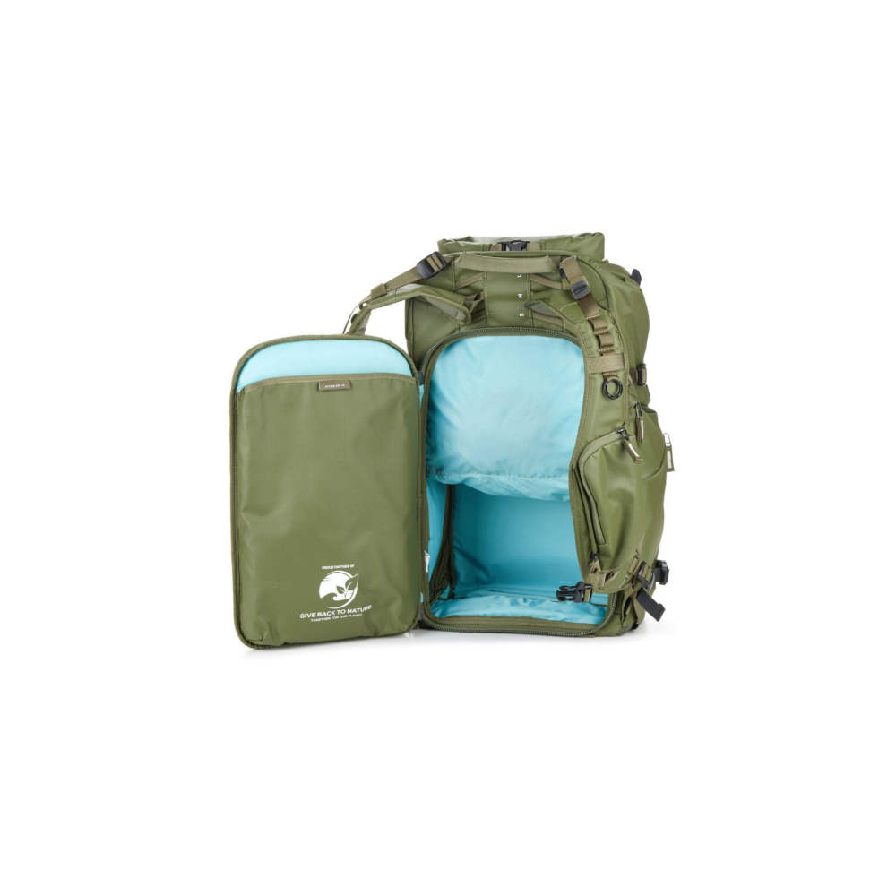 A green backpack with its main compartment open, revealing a blue interior.