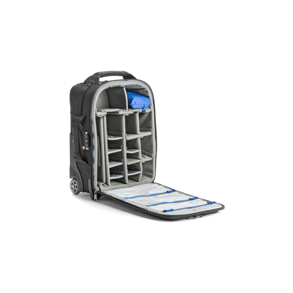 An open black rolling suitcase with padded compartments and a blue pouch.