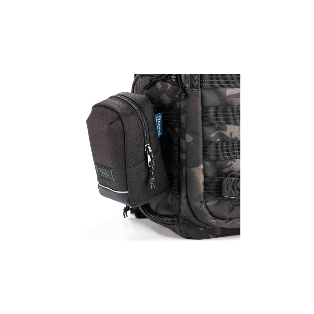 A black pouch is attached to a camouflage backpack.