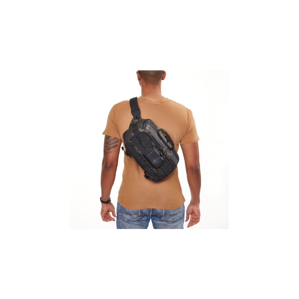 Man wearing a camouflage sling bag over his shoulder, wearing a brown t-shirt.