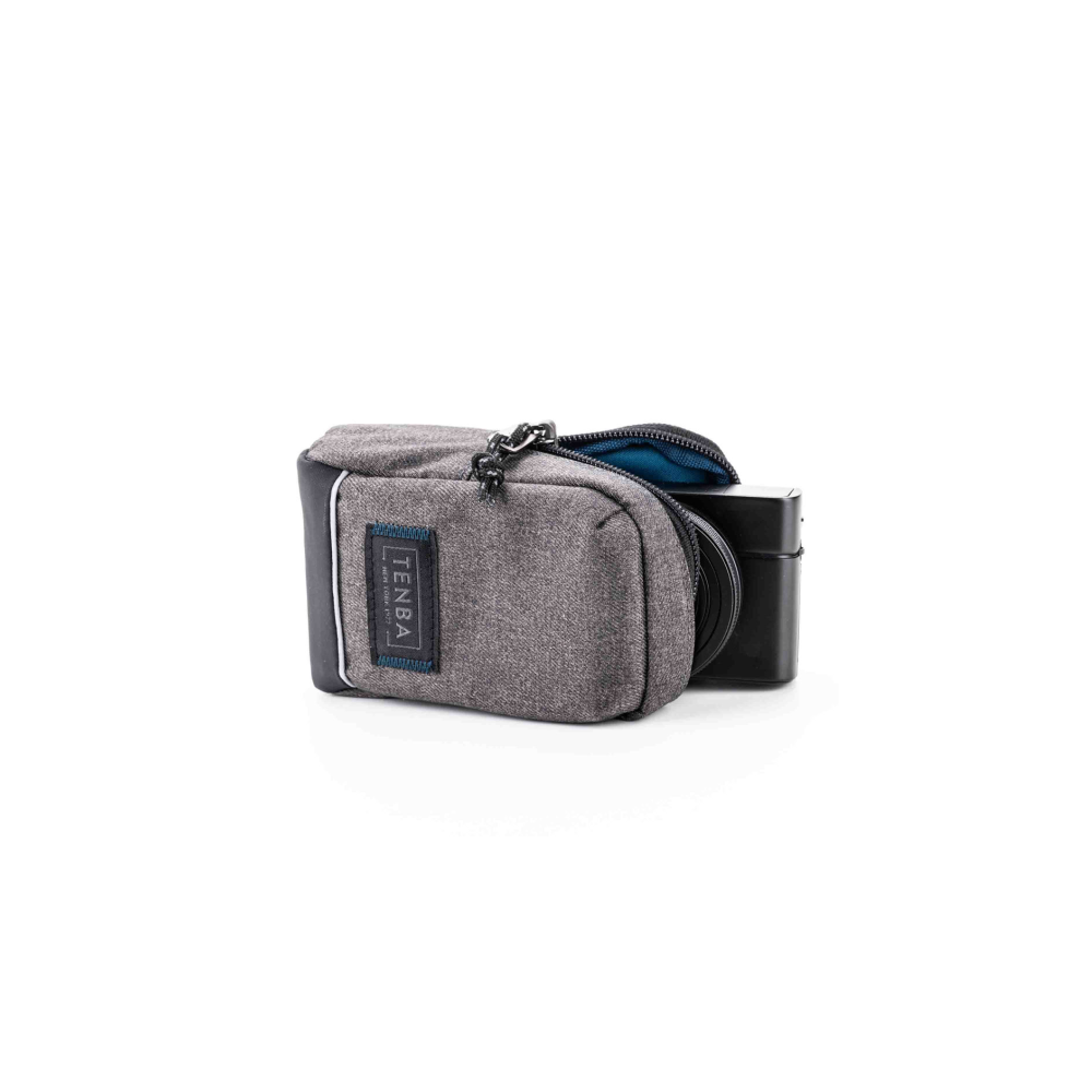 Gray camera bag with open zipper pouch revealing a black camera.