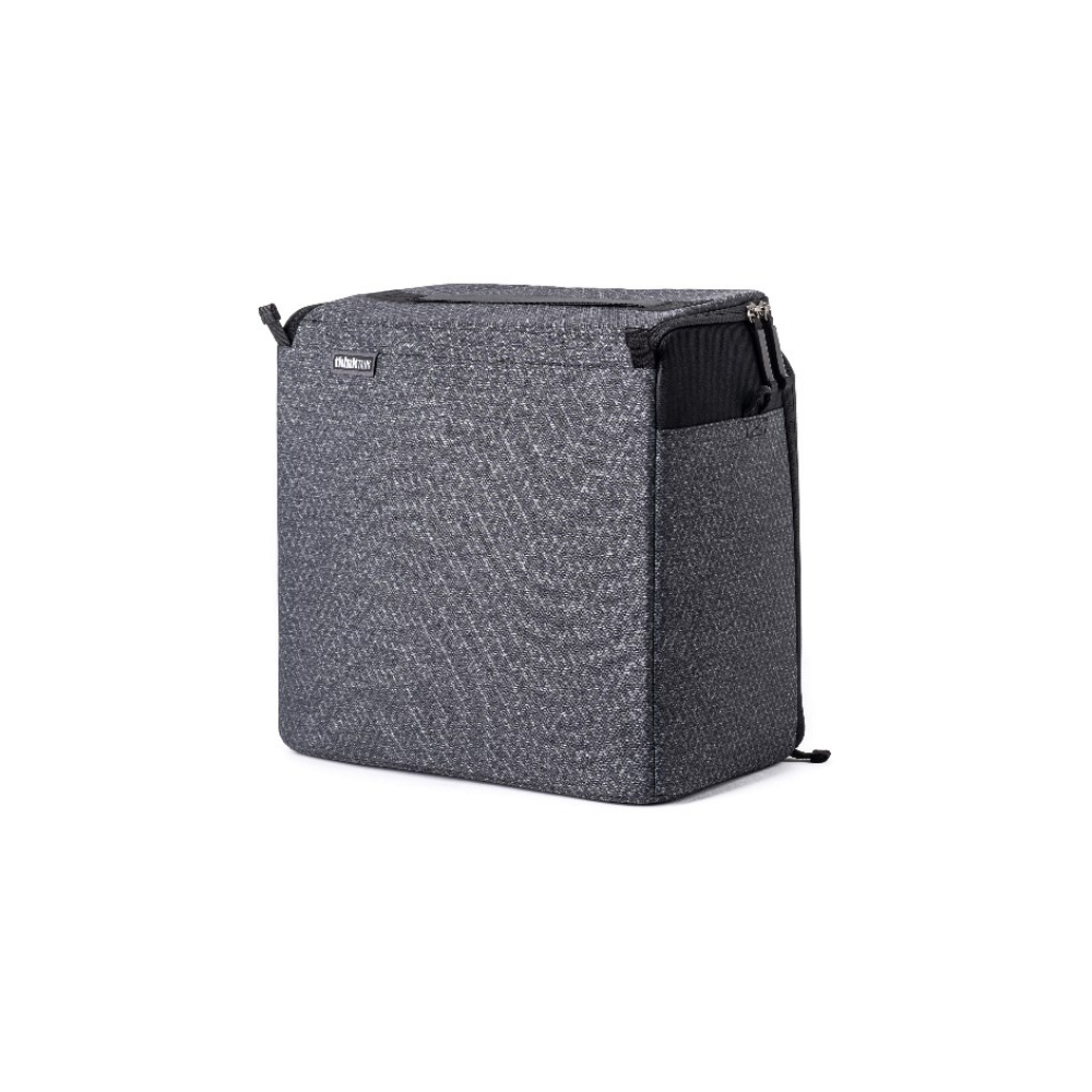 A grey patterned camera bag with a zipper and an outer pocket.