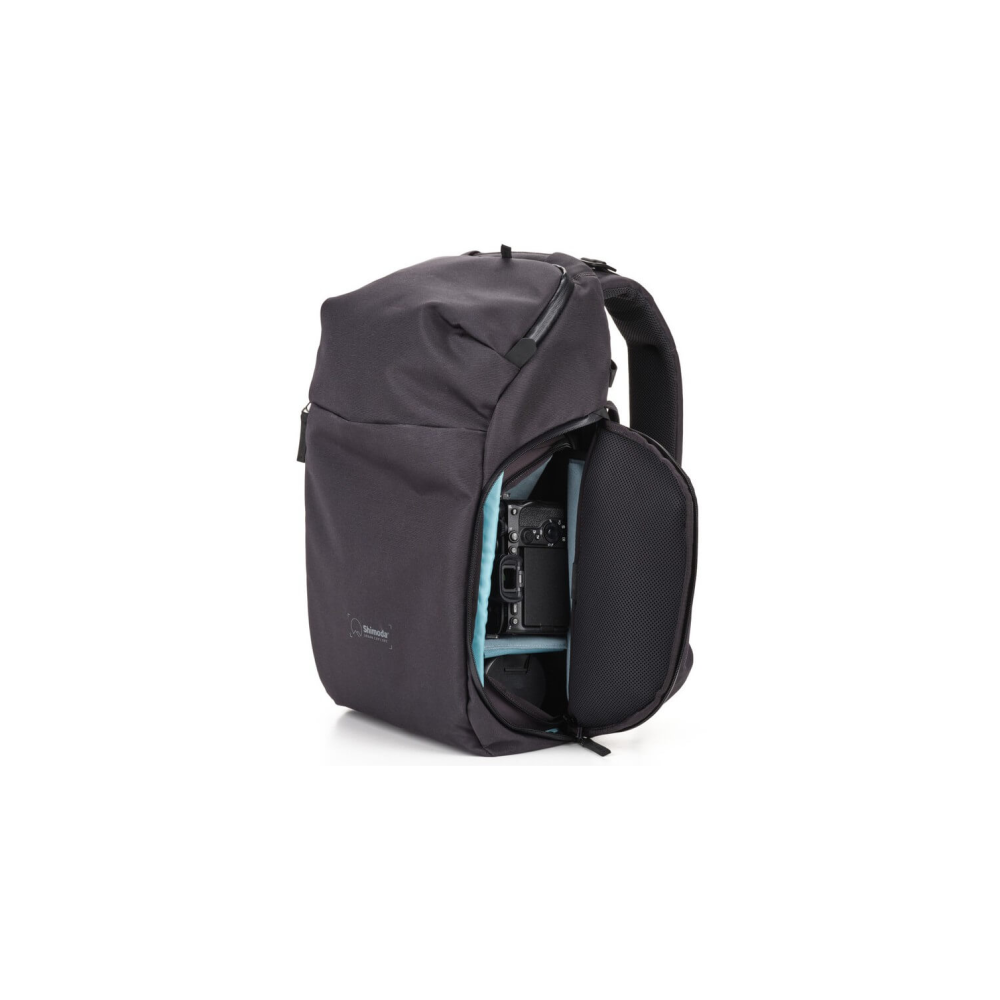 Dark gray backpack with an open side pocket revealing a camera and lens inside.