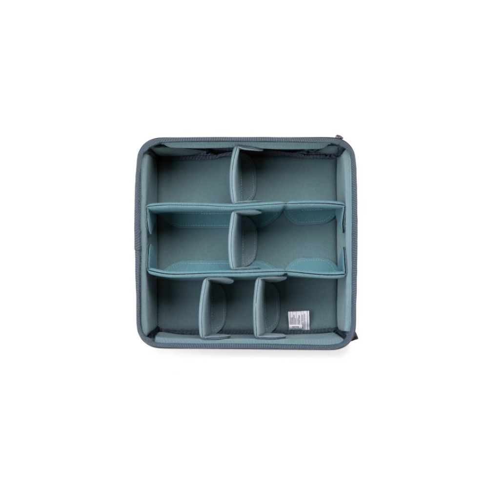 Gray organizer with teal dividers, empty and viewed from above.