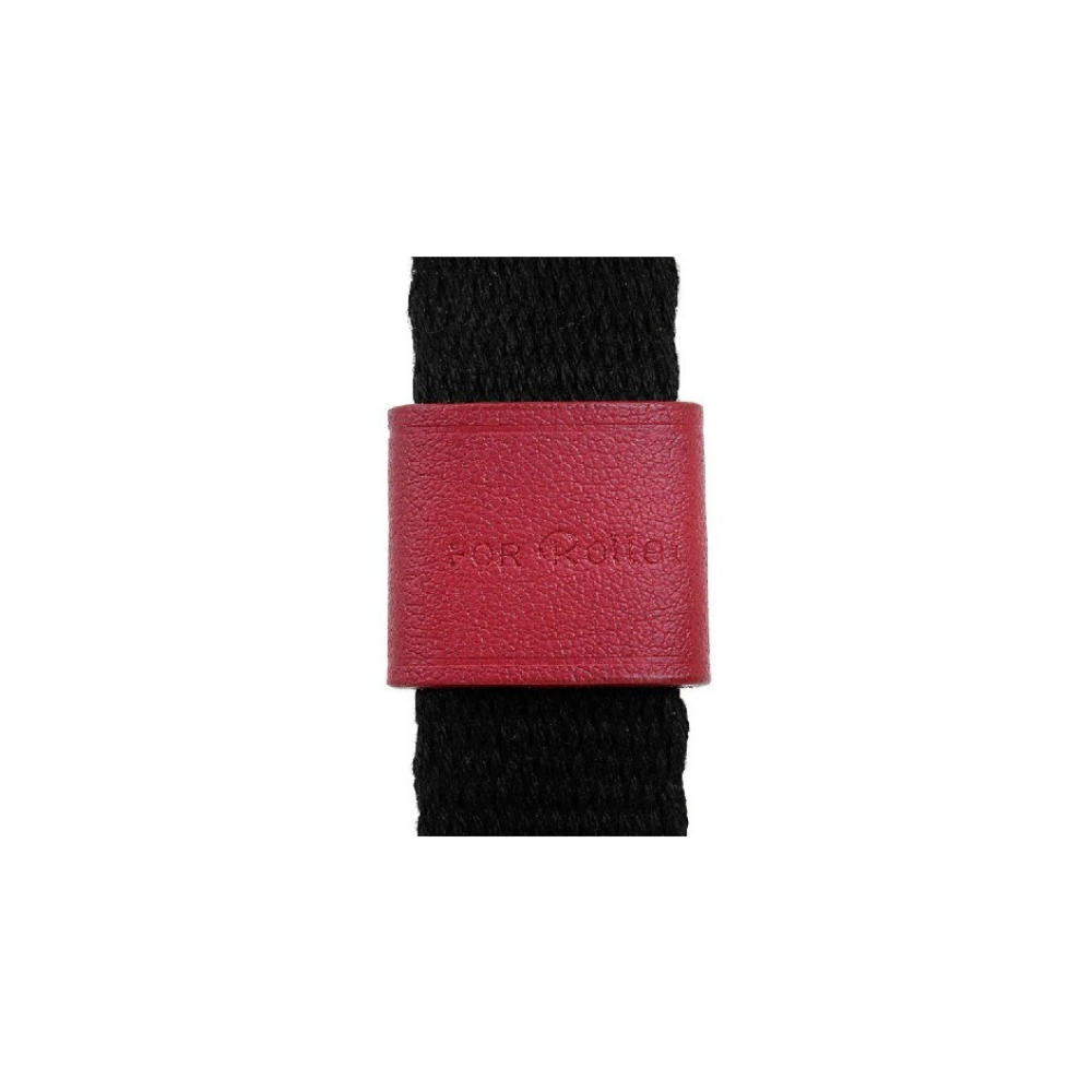 A red leather band on a black strap. It says „FOR ROLLE“.