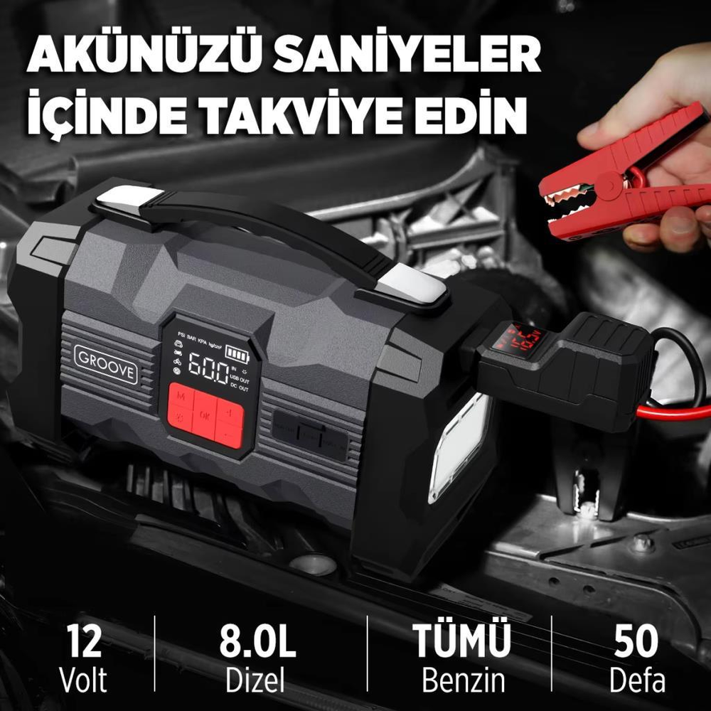 Kırmızı kelepçeli ve dijital ekranlı siyah taşınabilir akü takviye cihazı.