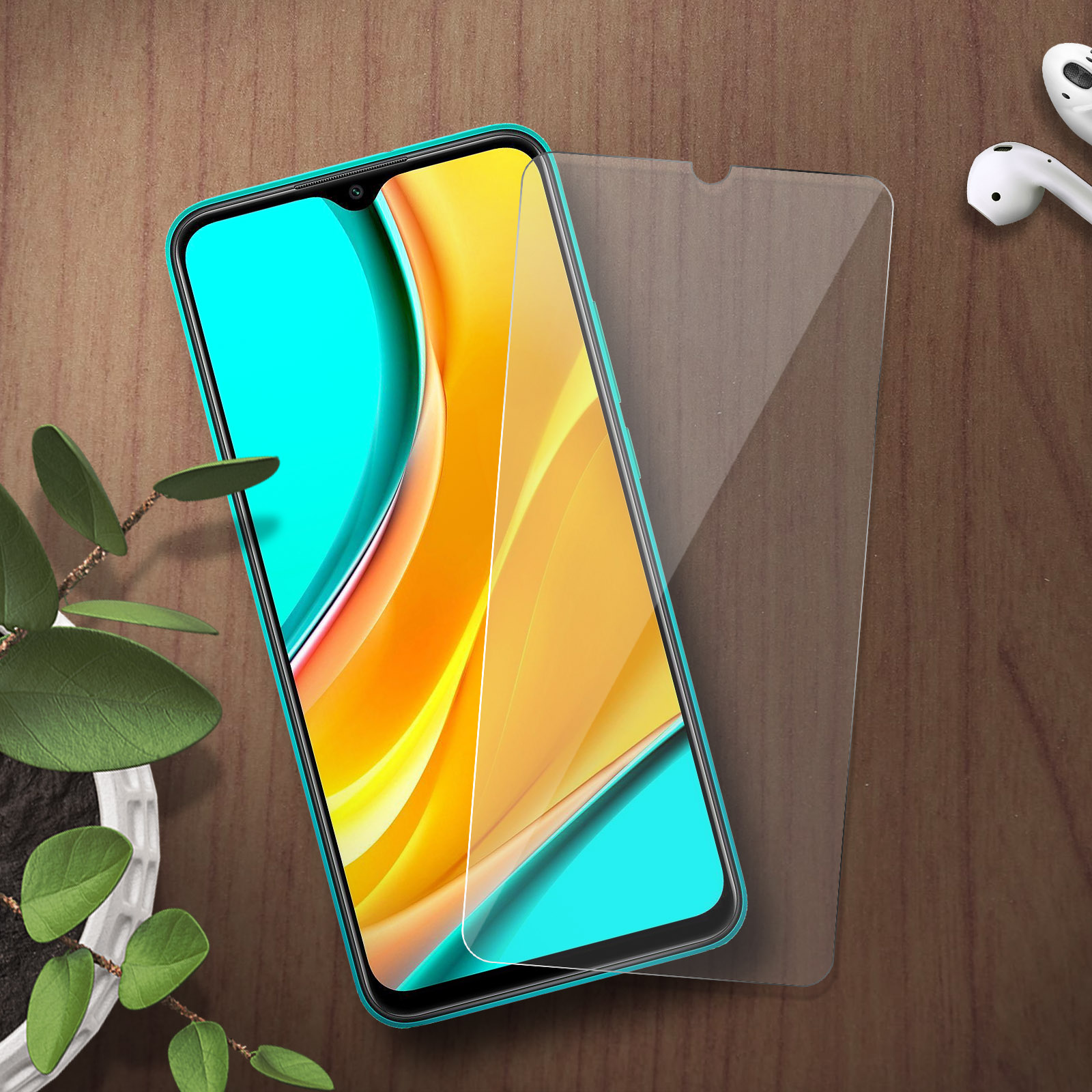 Een smartphone met turquoise hoes en schermprotector op een houten tafel.