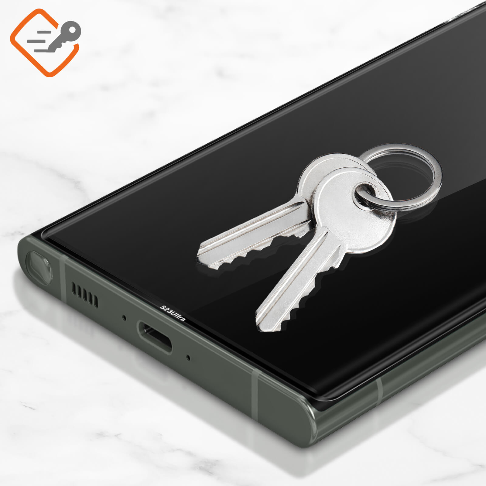 Due chiavi giacciono su uno schermo di smartphone scuro.