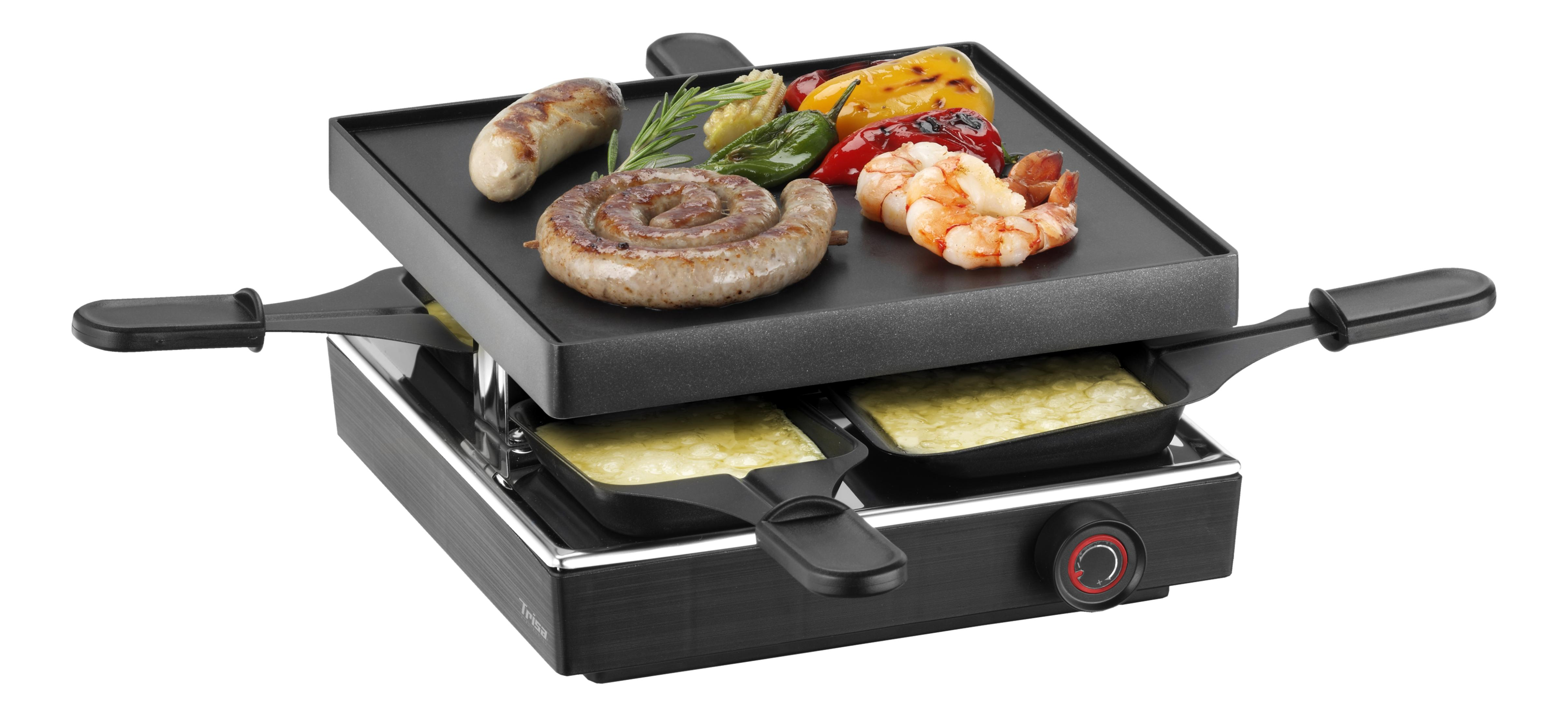 Ein Raclettegerät mit Wurst, Garnelen, Paprika und geschmolzenem Käse.