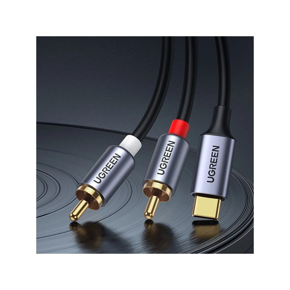 Trzy kable UGREEN ze złączami RCA i USB-C na ciemnym tle.
