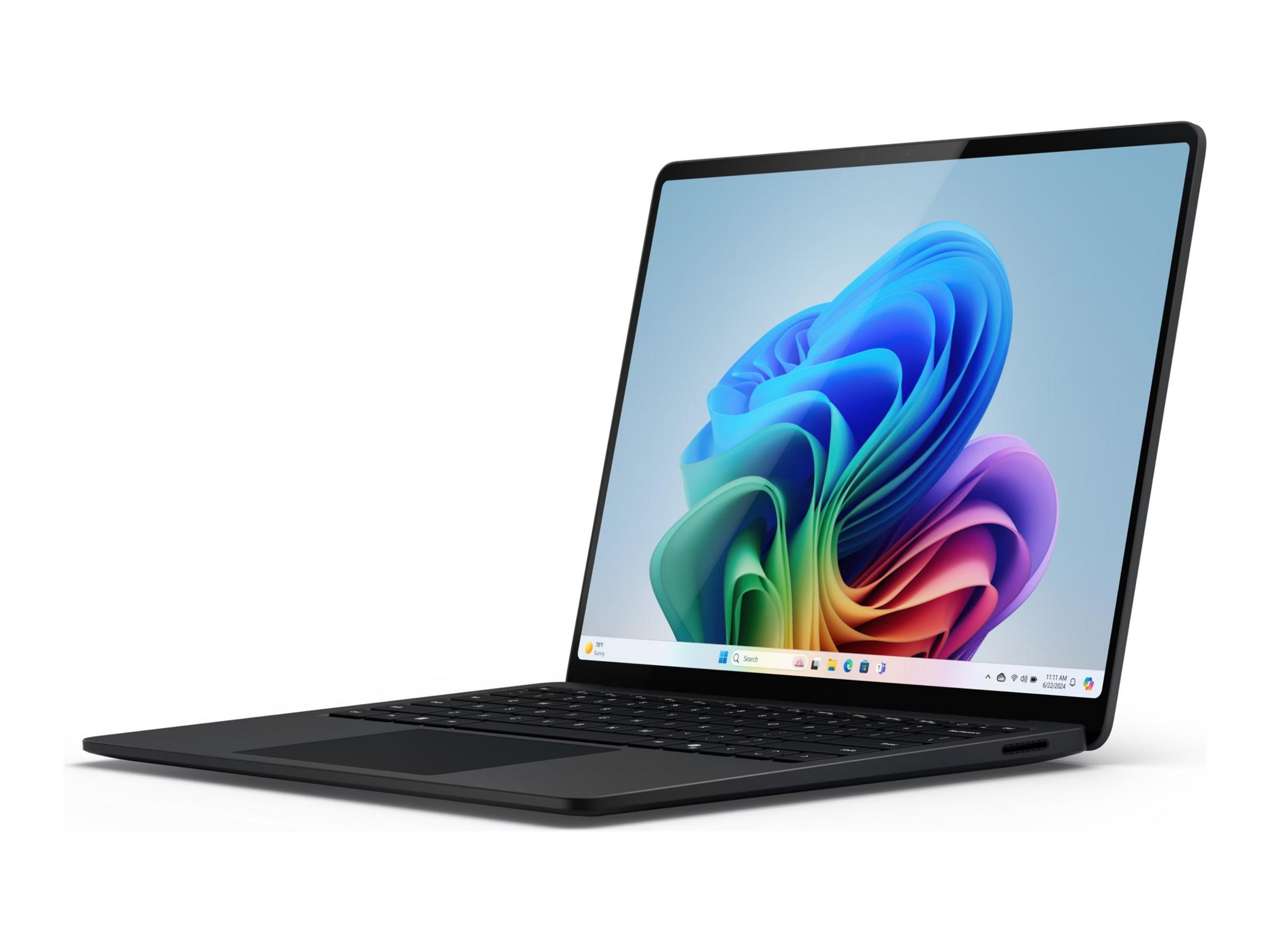 Schwarzer Laptop mit farbenfrohem Windows-Hintergrund und Tastatur.