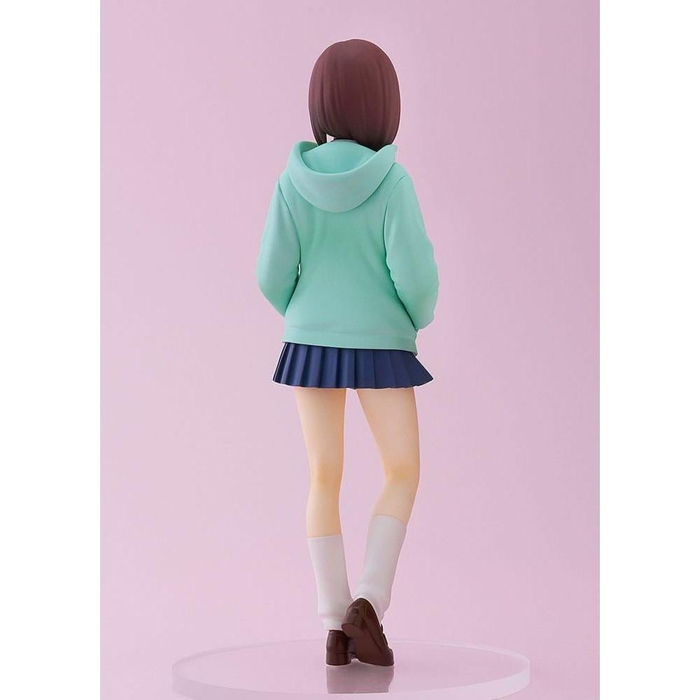 Figura de espaldas: chica con pelo castaño, sudadera menta, falda azul, calcetines blancos, zapatos marrones.