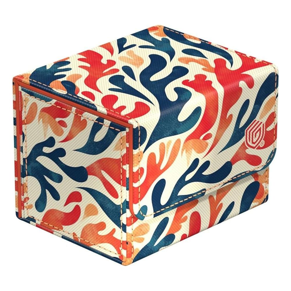 Una scatola bianca con motivo corallino blu, arancione e rosso.