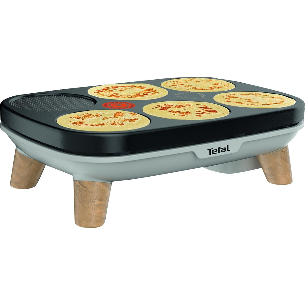 Ein Tefal-Pfannkuchengrill mit fünf fertigen Pfannkuchen und einem Grillbereich.