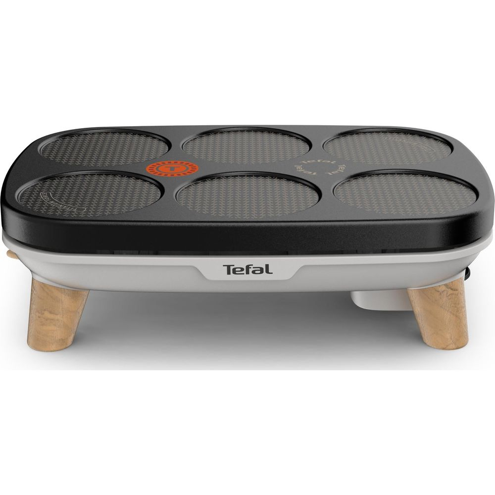 Ein Tefal-Pfannkuchengrill mit sechs runden Heizflächen und Holzfüßen.