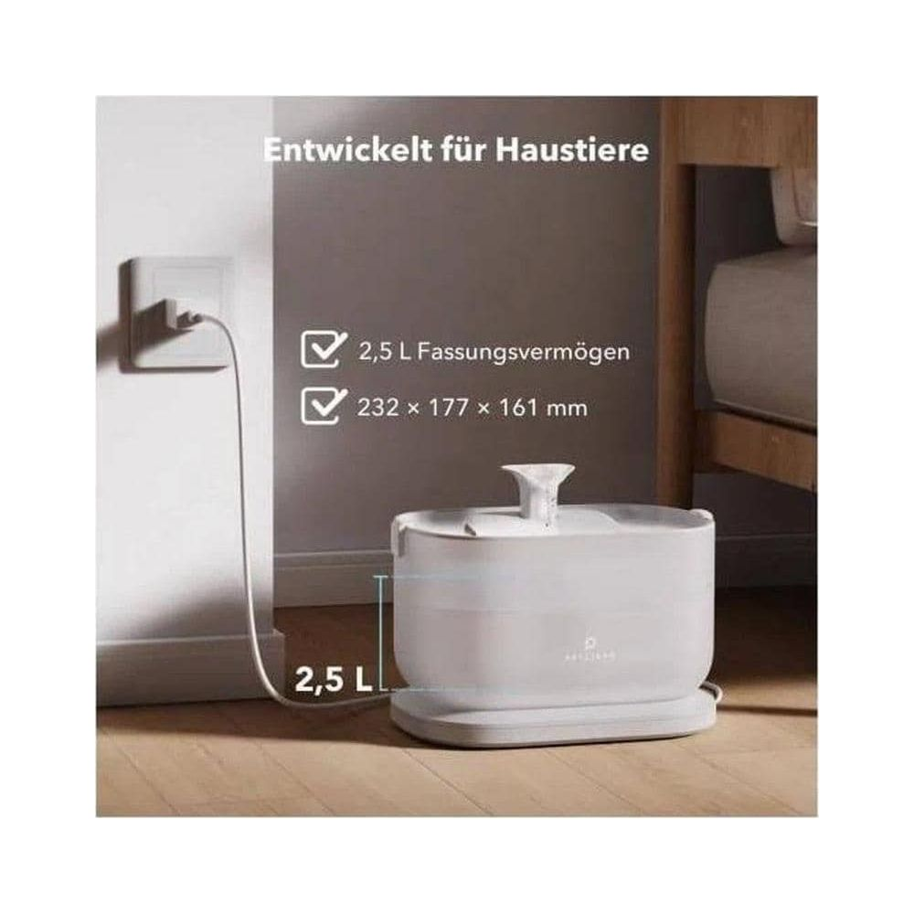 A white 2.5L pet drinking fountain is plugged into a wall socket.