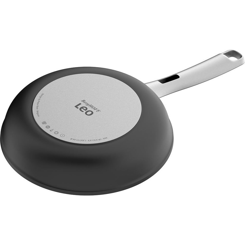 The underside of a black frying pan with a silver handle and BergHOFF Leo logo.