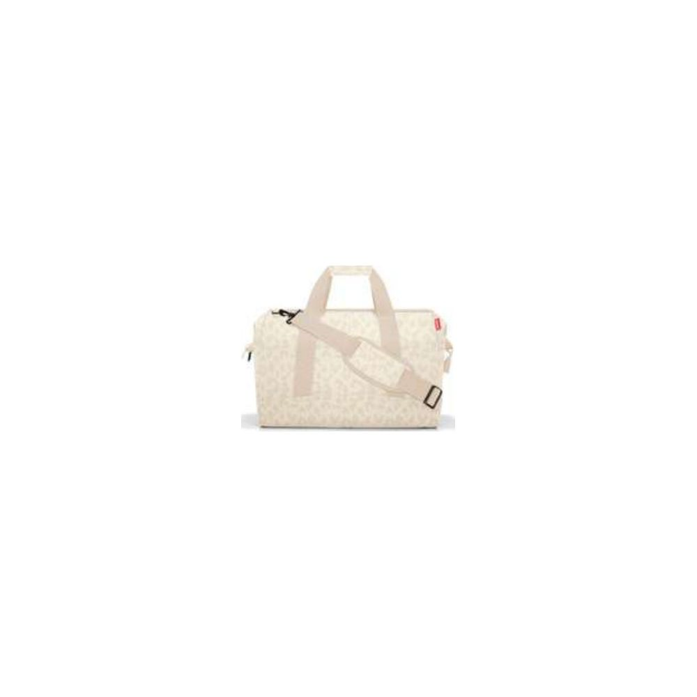 Eine cremefarbene Reisetasche mit Leopardenmuster und verstellbarem Tragegurt.