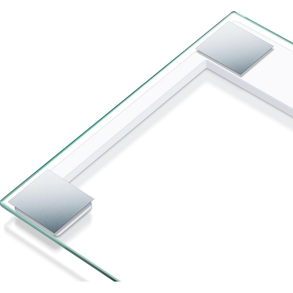 Primer plano de una báscula de vidrio con detalles blancos y sensores plateados.
