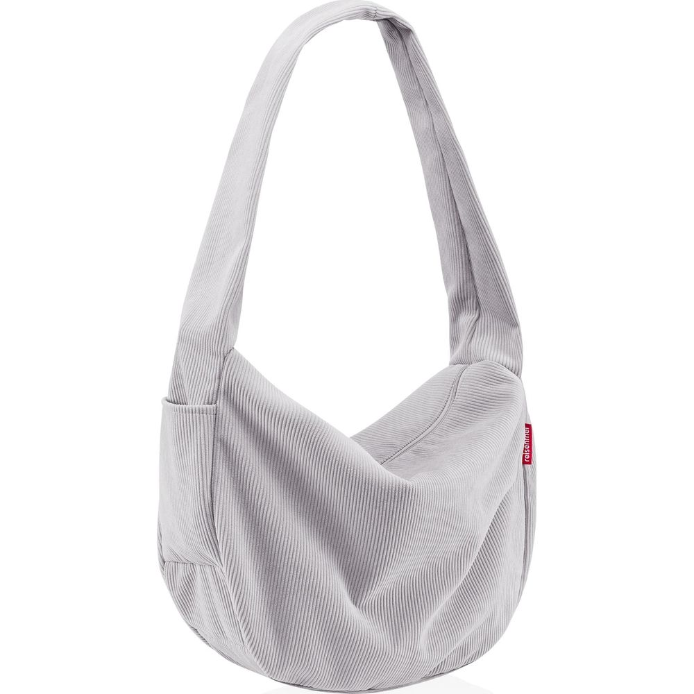 Eine hellgraue Cord-Tasche mit einem einzelnen Riemen und einer Außentasche.