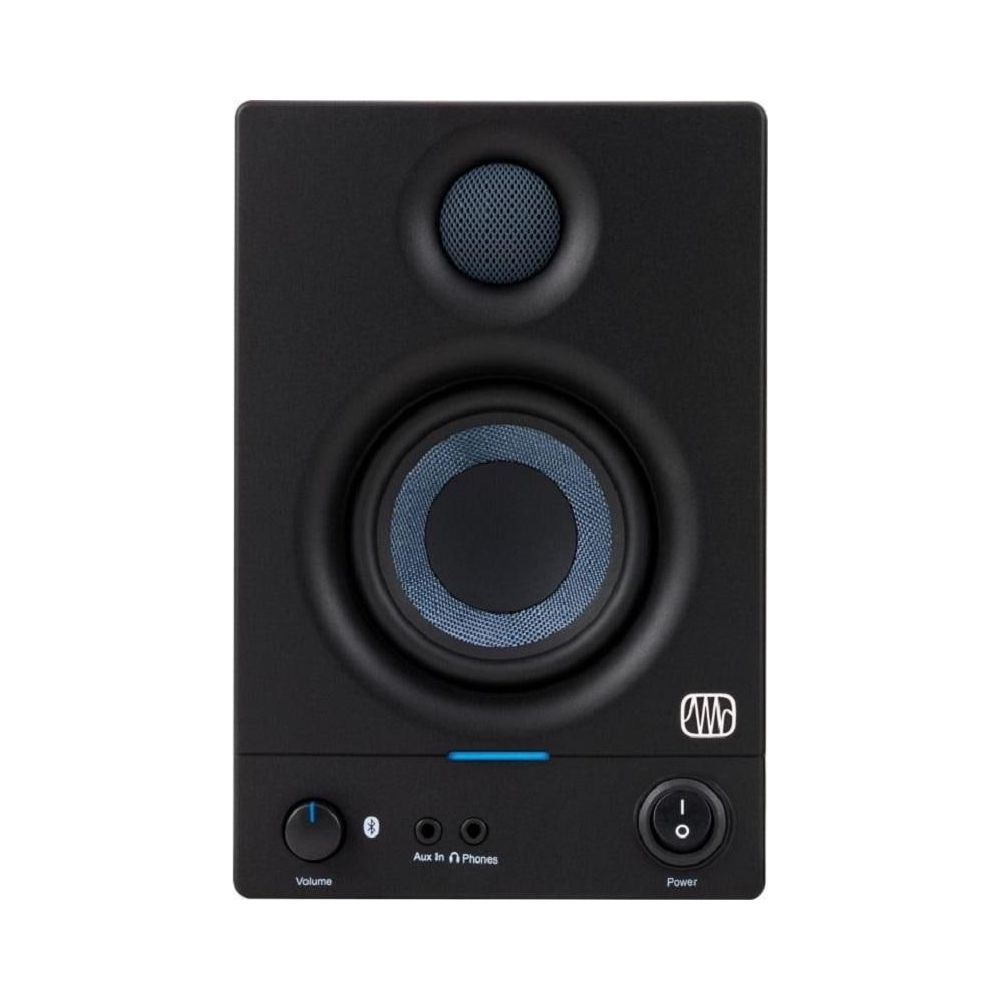 Altavoz negro con acento azul, control de volumen, entrada auxiliar y botón de encendido.