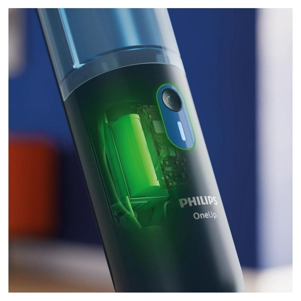 Golarka elektryczna Philips OneUp z widoczną zieloną baterią i niebieskim przyciskiem.