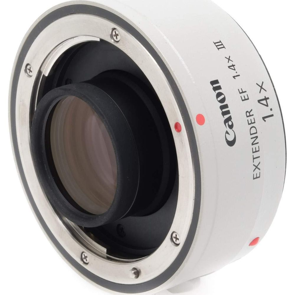 Extenseur Canon EF 1,4x III avec points rouges et corps argenté.