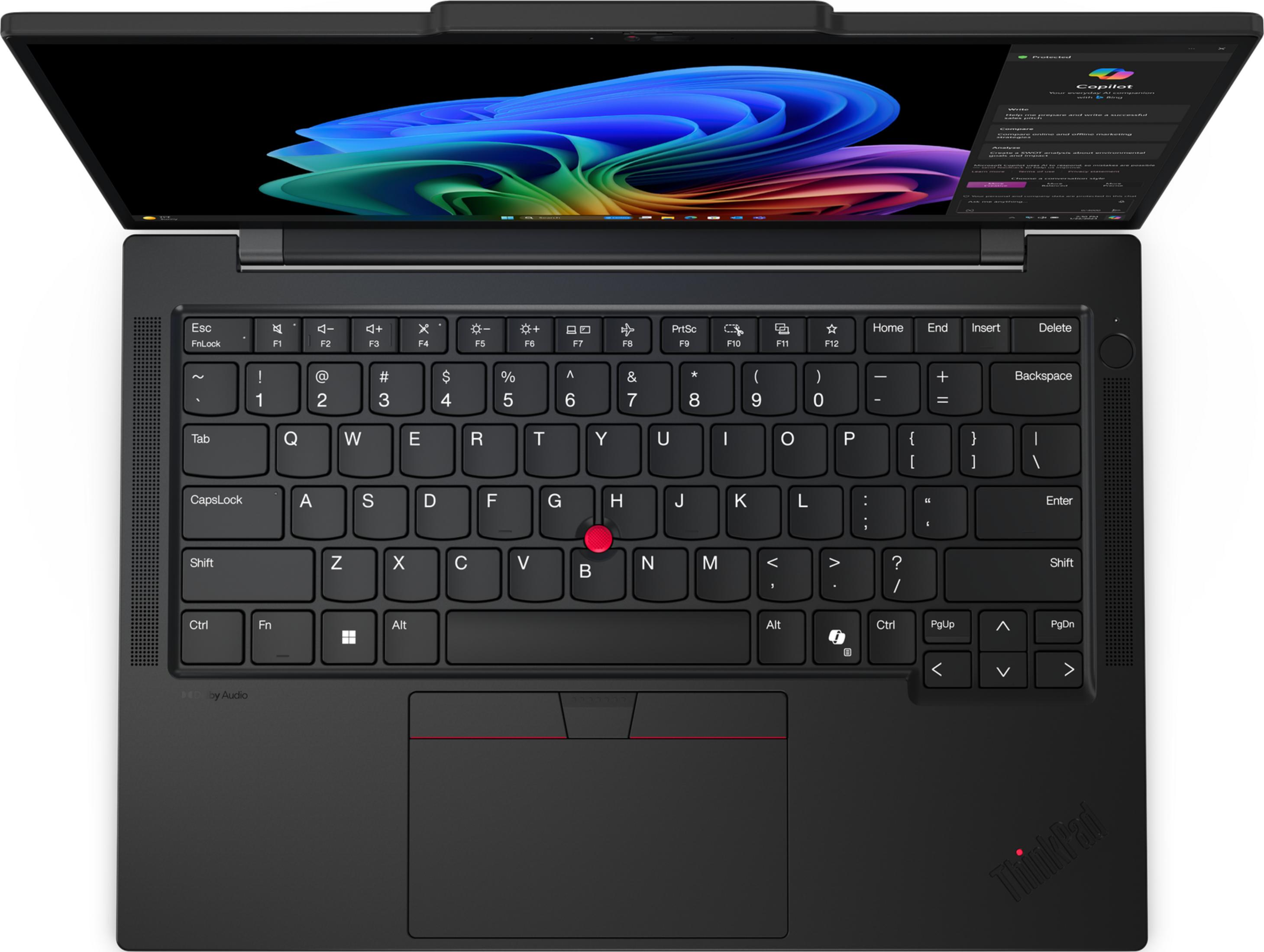 Otwarty czarny laptop wyświetlający kolorową tapetę na ekranie.