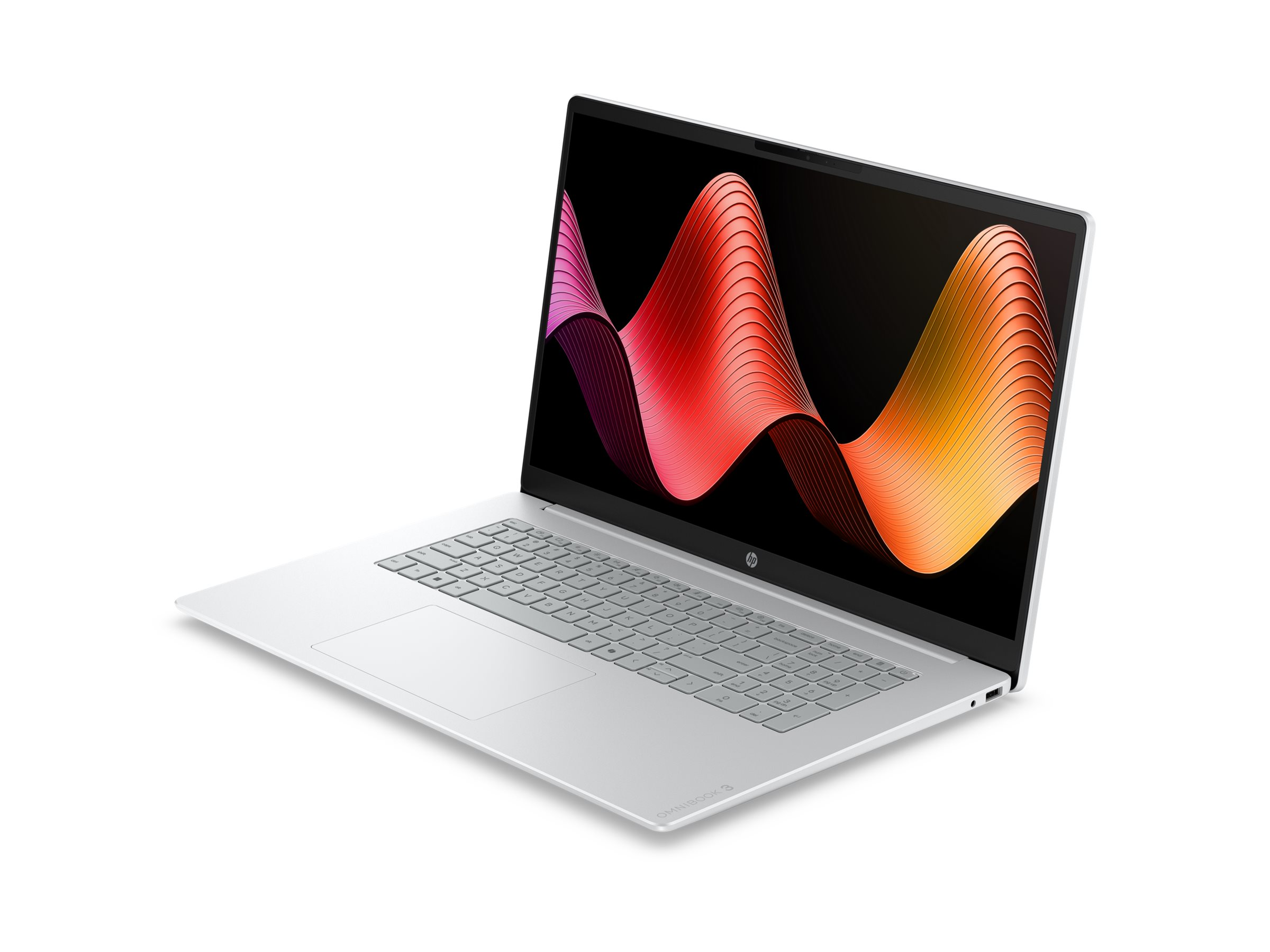 Ein offener silberner Laptop mit einem bunten Wellenmuster auf dem Bildschirm.