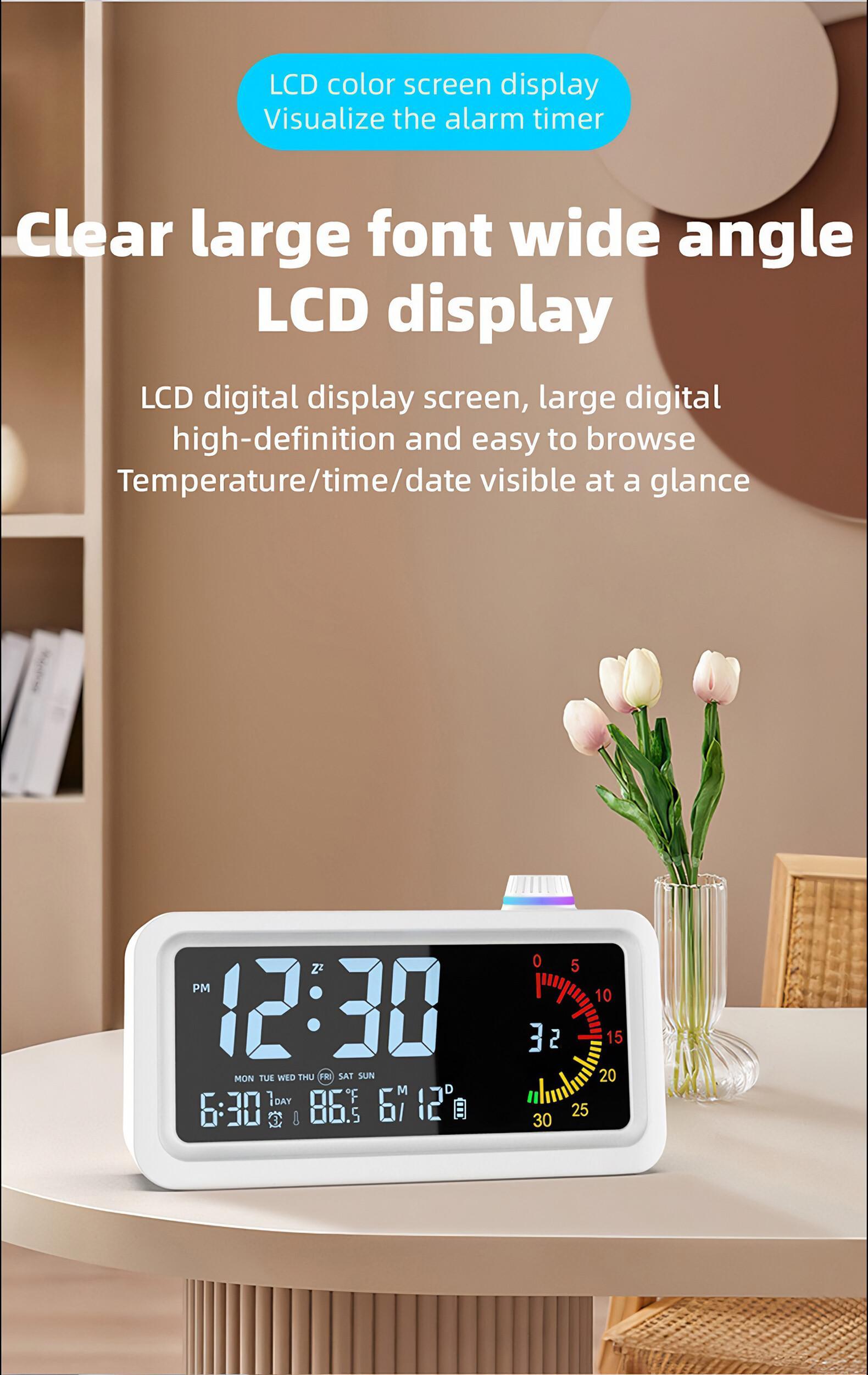 Ein weißer Digitalwecker zeigt 12:30 Uhr, 6:30 Uhr und 86,5°F. Tulpen stehen im Hintergrund.
