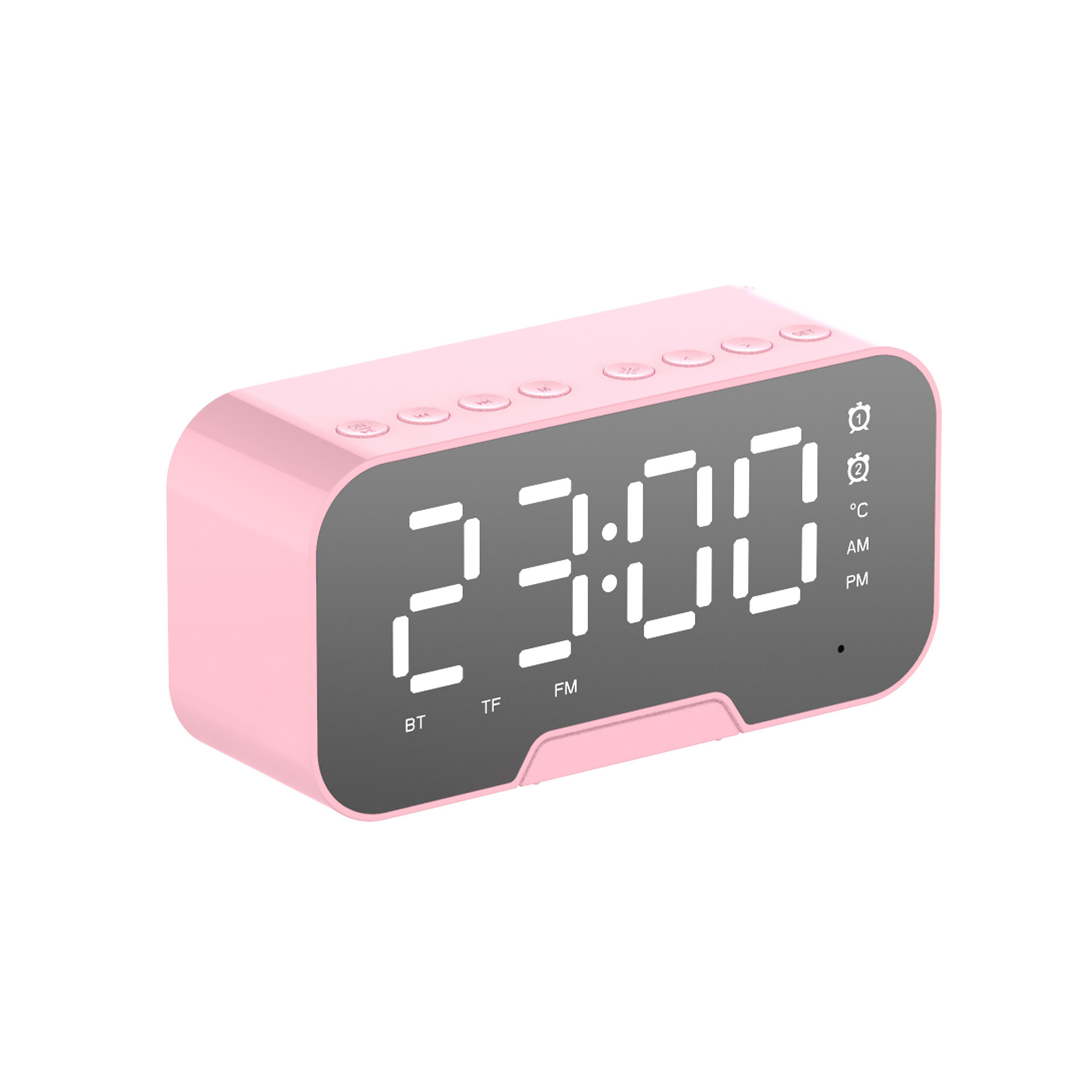 Ein rosafarbener Digitalwecker zeigt 23:00 an. Oben sind Knöpfe.