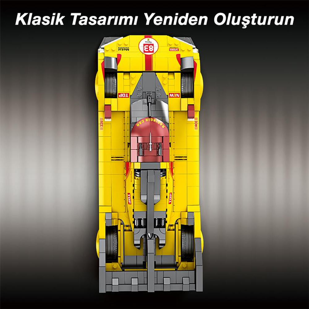 Kırmızı ve gri vurgulu sarı yarış arabası, yukarıdan görünüm.