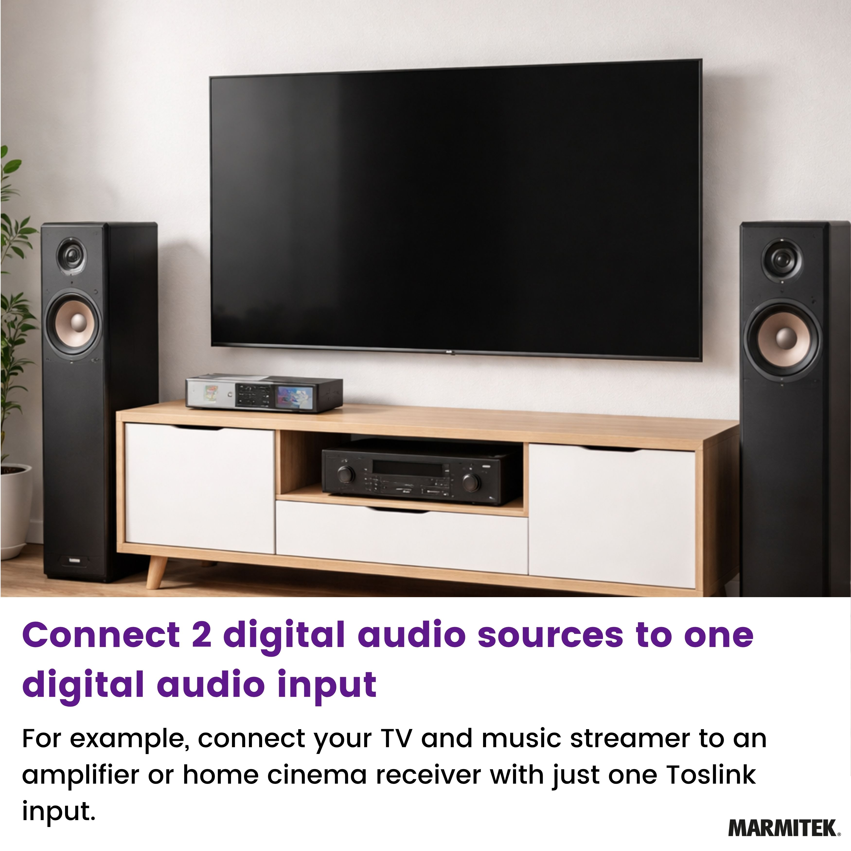 Black TV above wooden media console with two speakers.