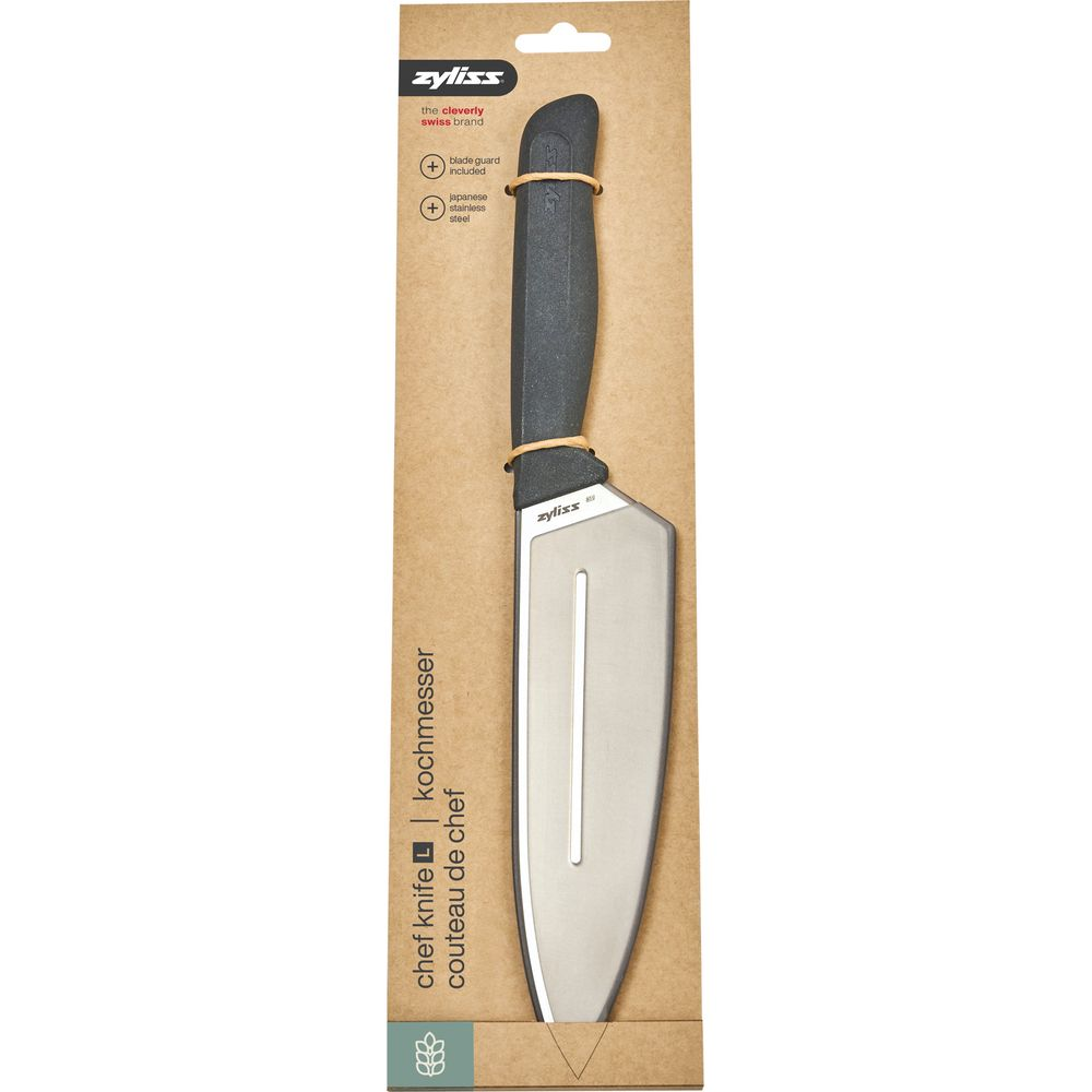 Ein Zyliss Kochmesser mit schwarzem Griff und Edelstahlscheide in Verpackung.