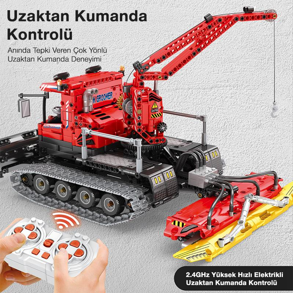Kırmızı, uzaktan kumandalı paletli araç, vinç ve kar küreme aparatı, uzaktan kumanda ile çalıştırılıyor.