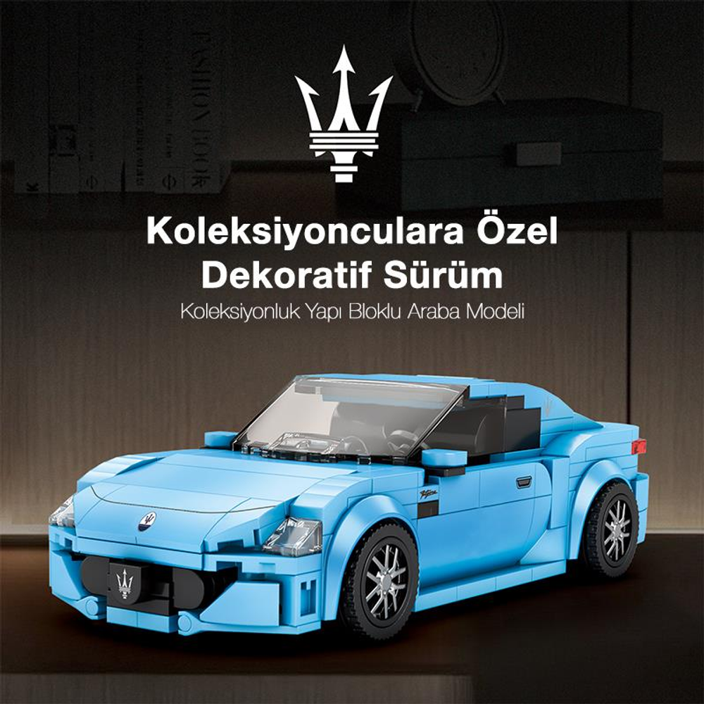 Koyu yüzey üzerinde açık mavi Lego araba modeli.