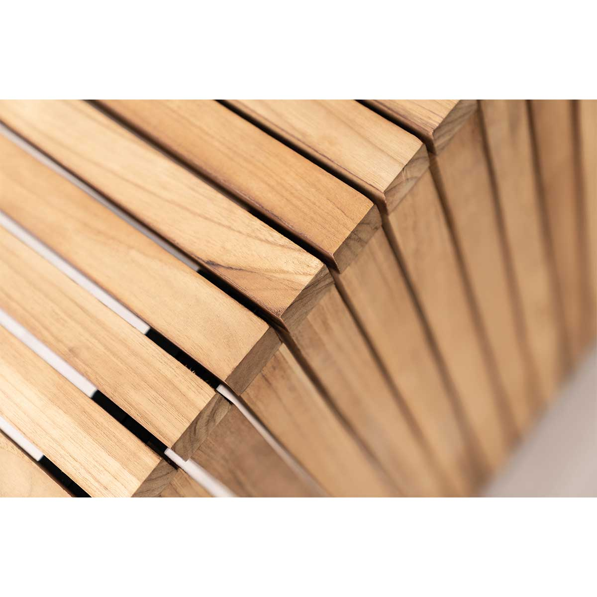 Close-up of wooden slats on a stool or table, forming a pattern.
