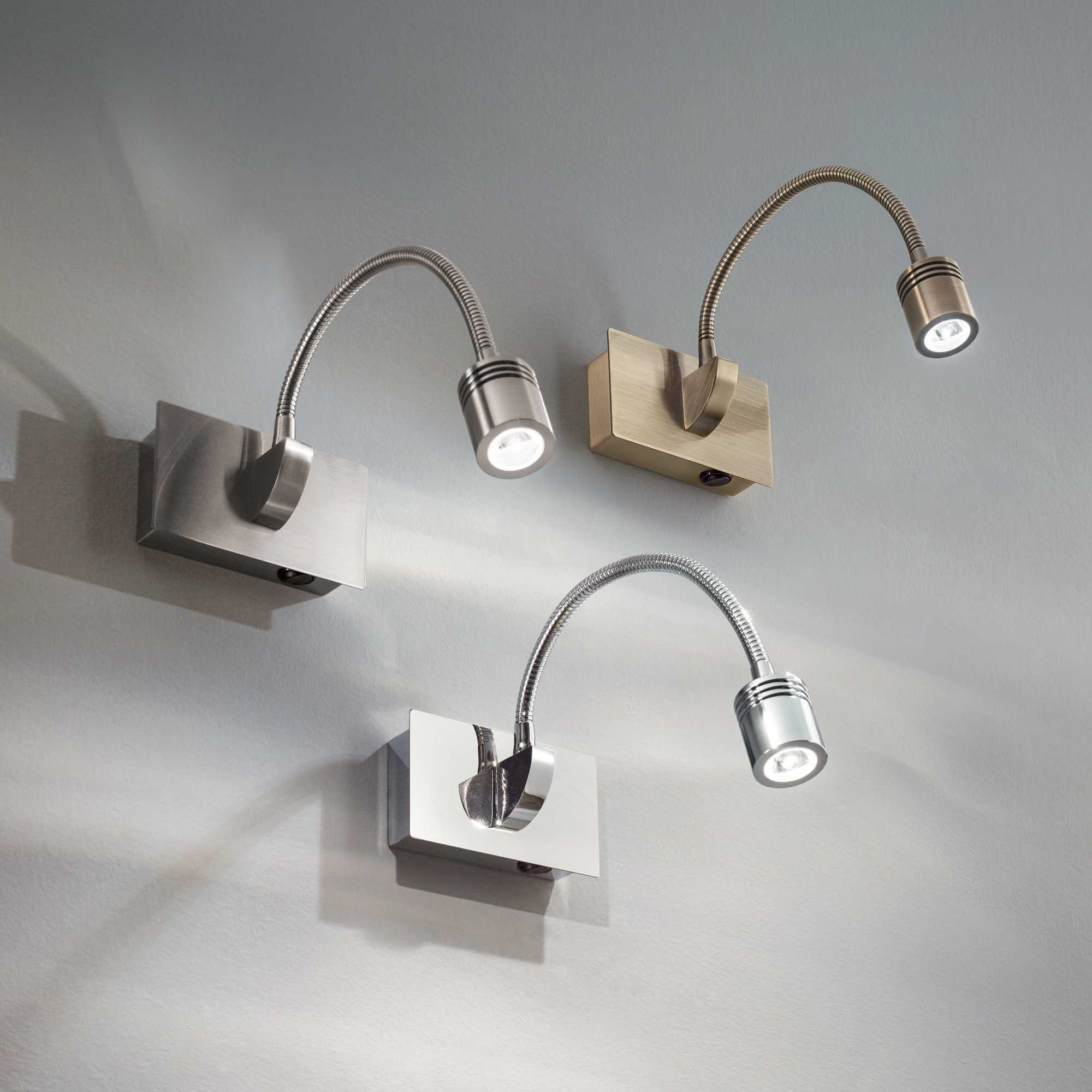 Tre applique da parete flessibili a LED su parete grigia.