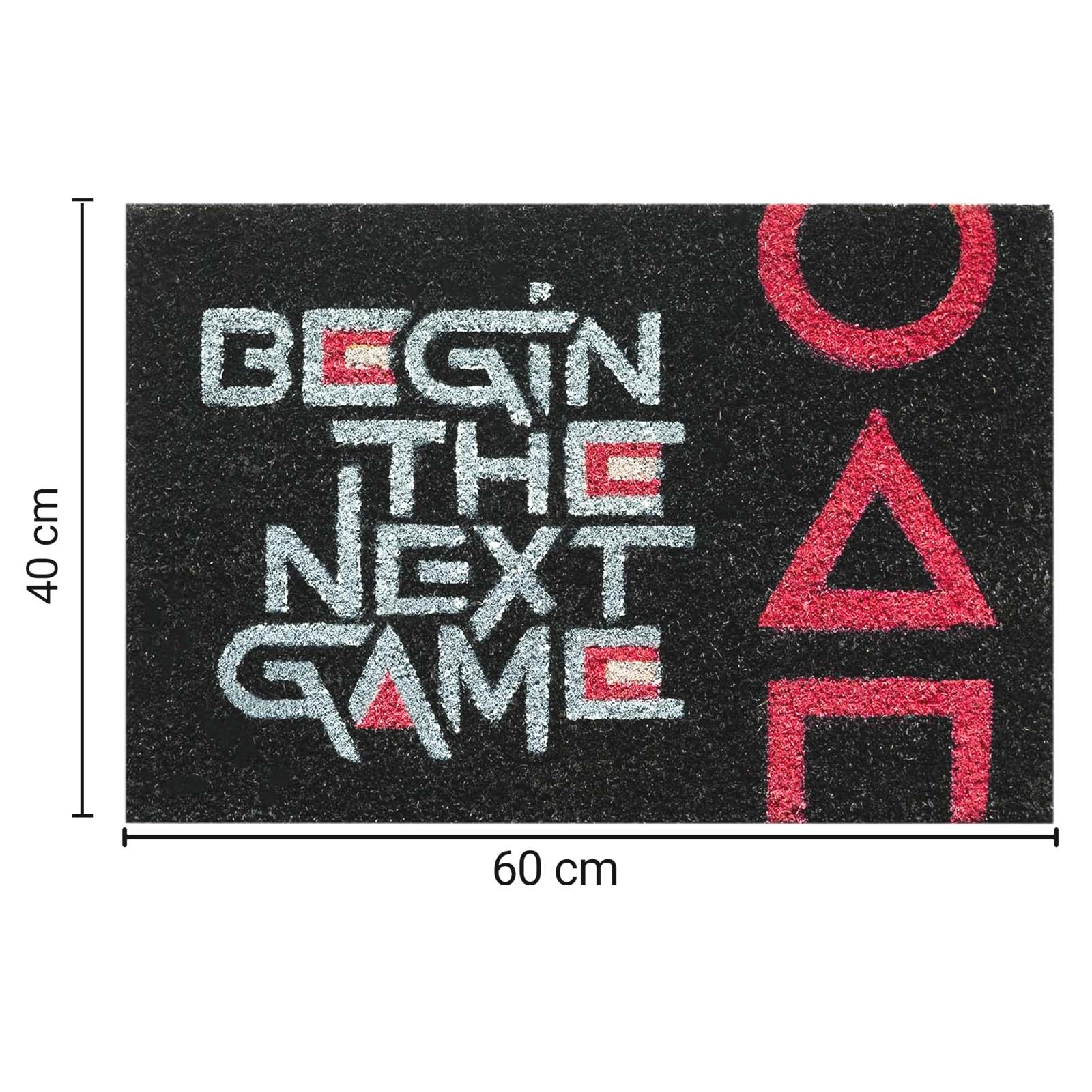 Tappetino nero con testo bianco e rosso "BEGIN THE NEXT GAME" e simboli rossi.