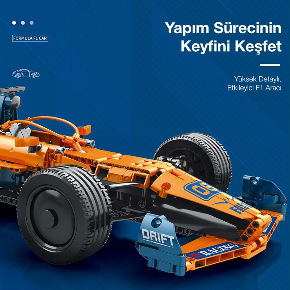 Mavi arka plan üzerinde mavi vurgulara sahip turuncu F1 oyuncak araba.