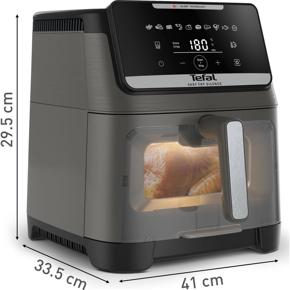Una friggitrice ad aria Tefal con un pollo arrosto all'interno.