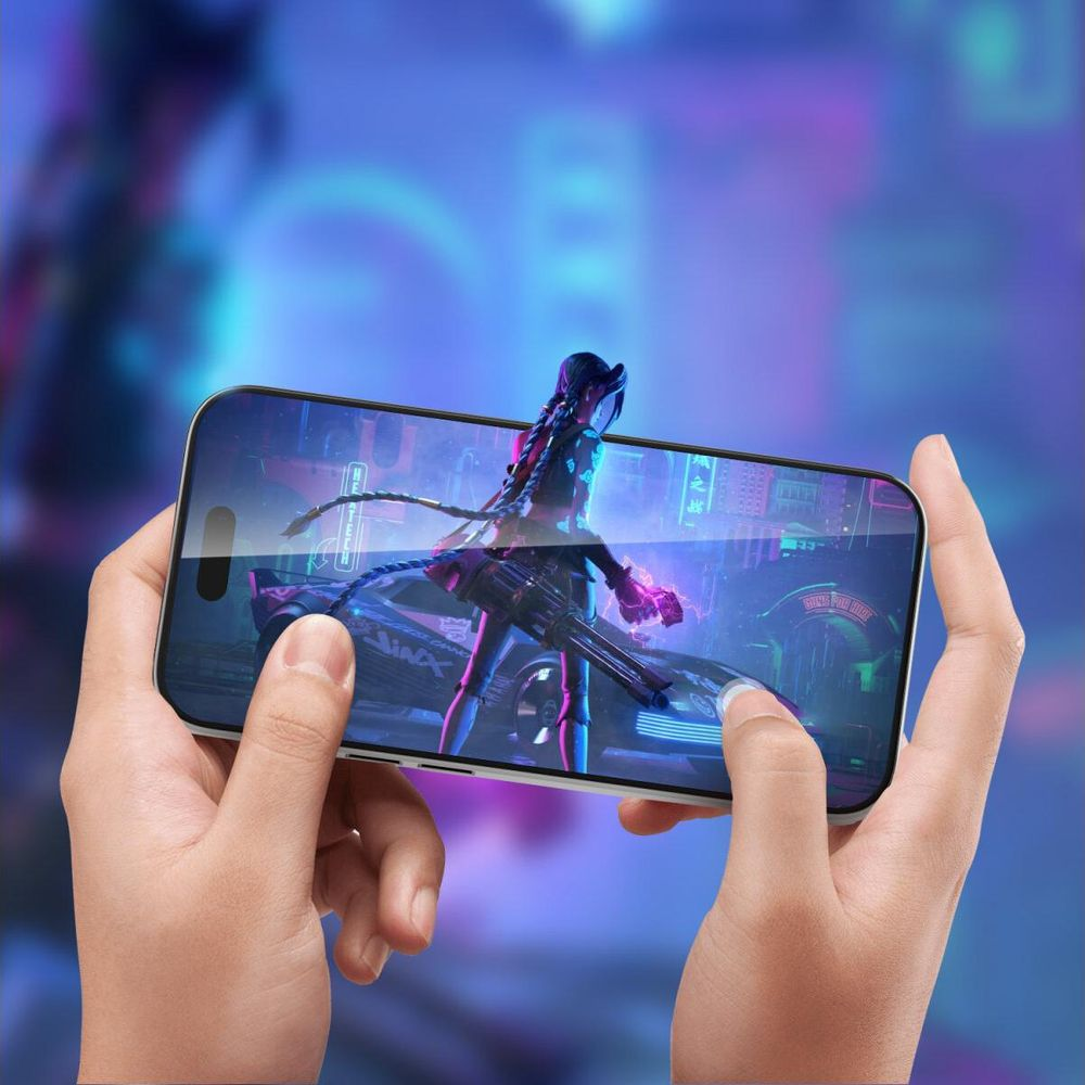 Person holds smartphone with Jinx character from Arcane on screen.