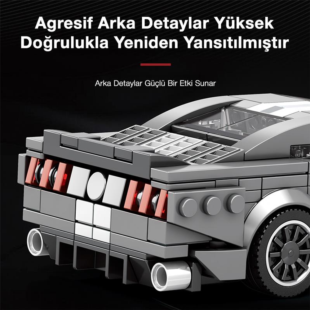 Kırmızı arka lambalara ve egzoz borularına sahip gri Lego araba arkası.